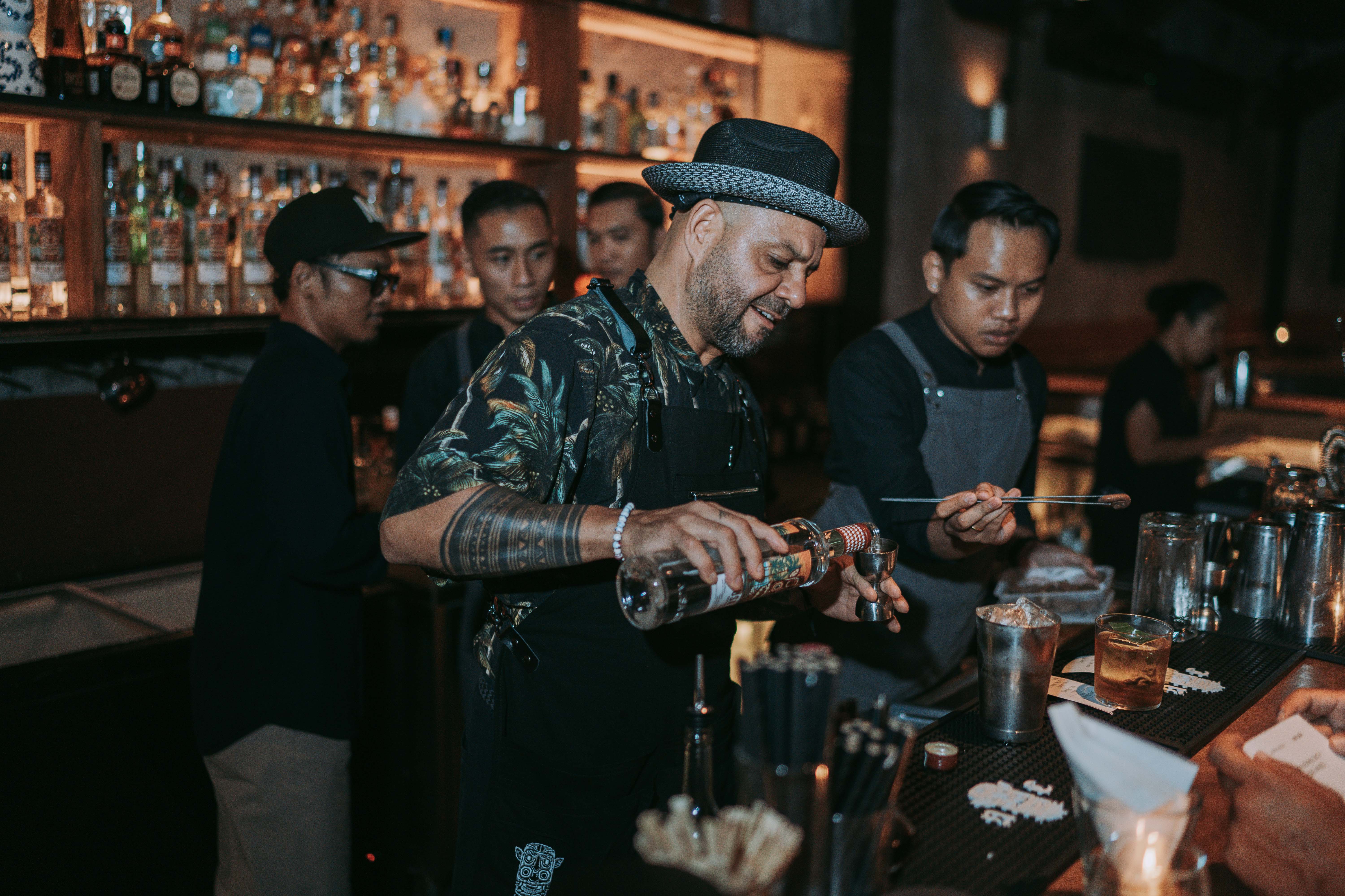 Dré and his protégés in action behind the bar for the night.